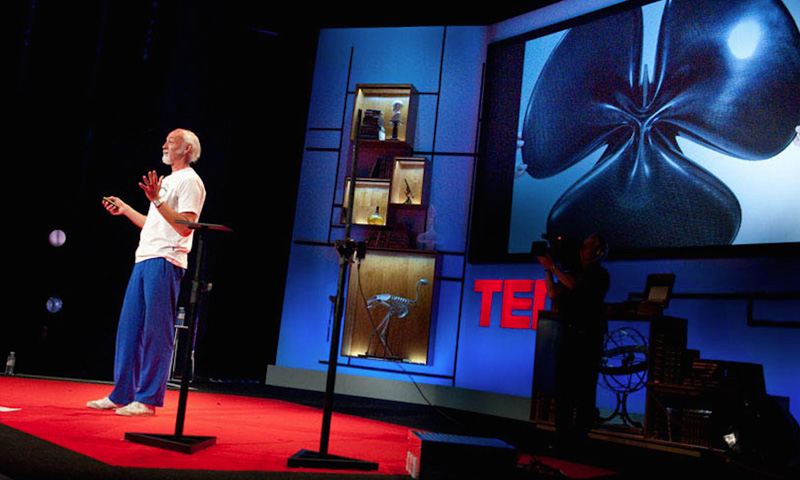 Photo of Ross Lovegrove presenting his work on the stage of TED conference